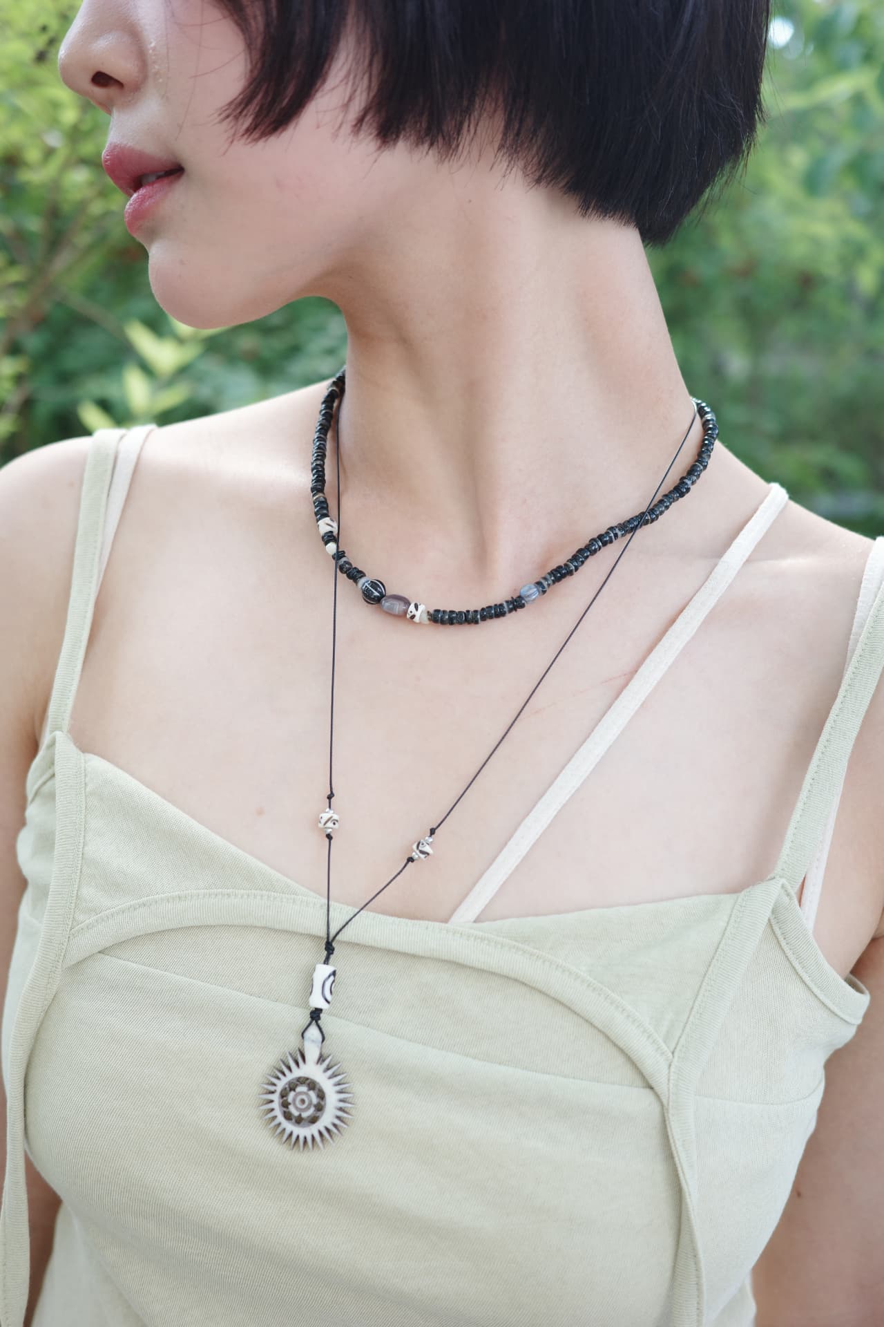Sun pendant necklace, worn