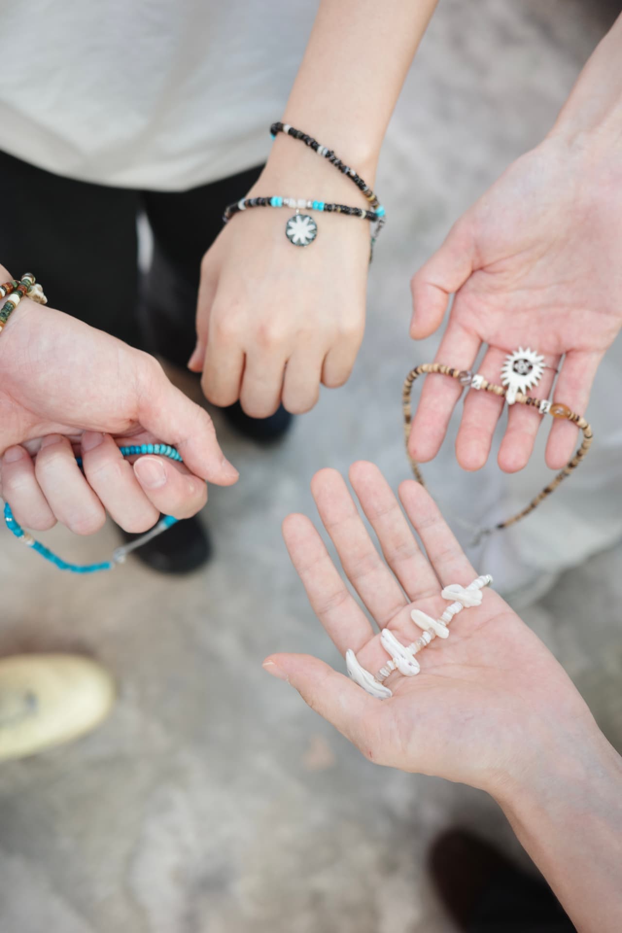 Bracelets and pieces in hand